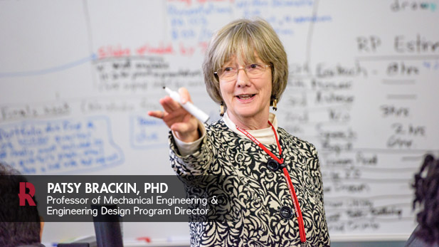 Dr. Brackin in classroom, working with students.
