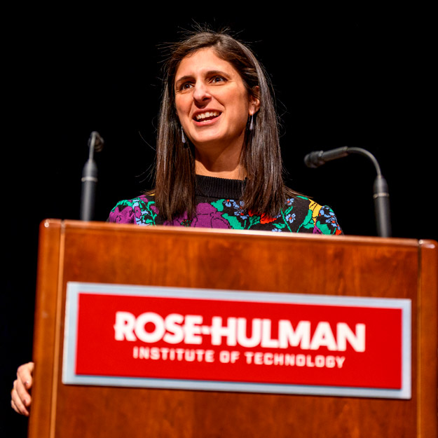 Nina Tandon speaks behind a podium with a Rose-Hulman logo.