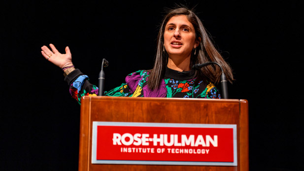 Nina Tandon speaks behind a podium with a Rose-Hulman logo.