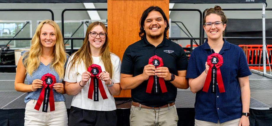 Several students with red award ribbons.