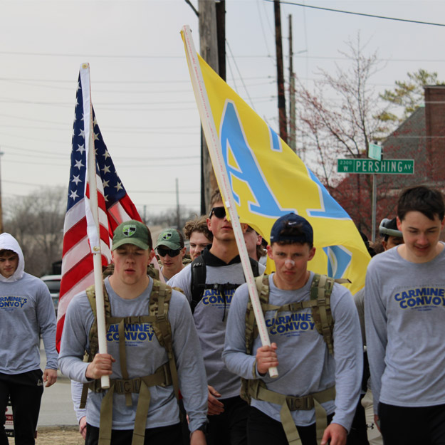 ATO fratnerity brothers present a large check outside Riley Hospital for Children.