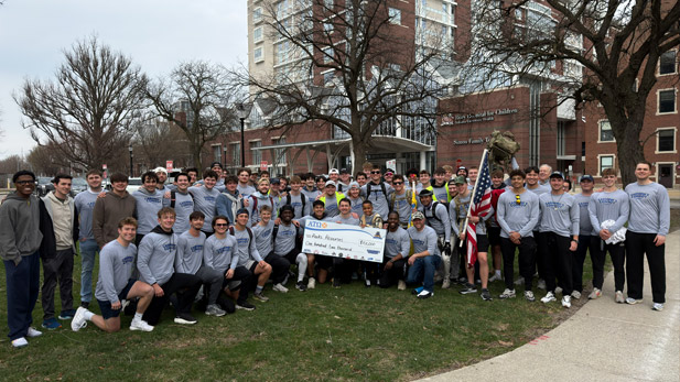 ATO fratnerity brothers present a large check outside Riley Hospital for Children.