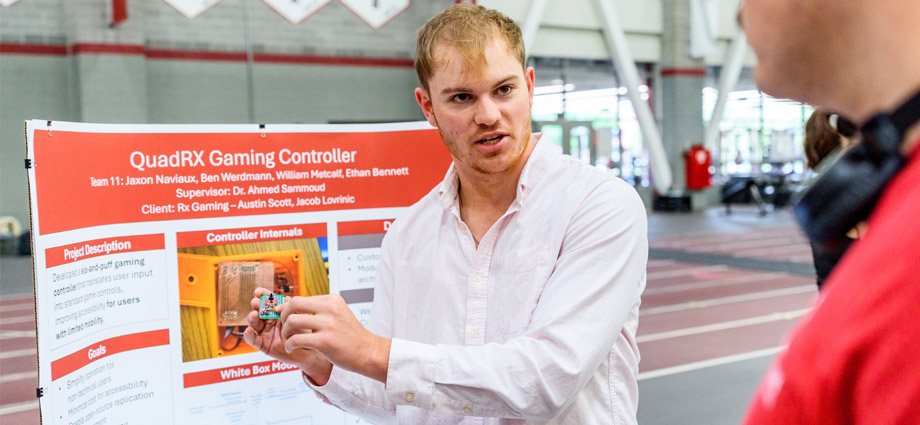 A student demonstrates the chip in the accessible controller.
