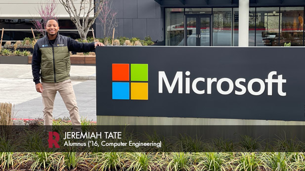 Jeremiah Tate beside a Microsoft sign outside the company headquarters.