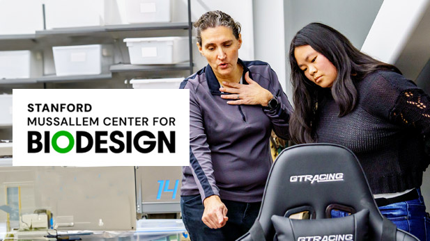 Rose-Hulman Dean of Faculty Renee Rogge, PhD, is helping to a student in a lab.