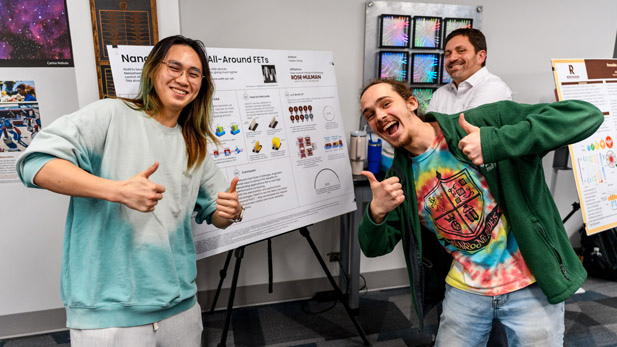 Students present posters about their semiconductor research.